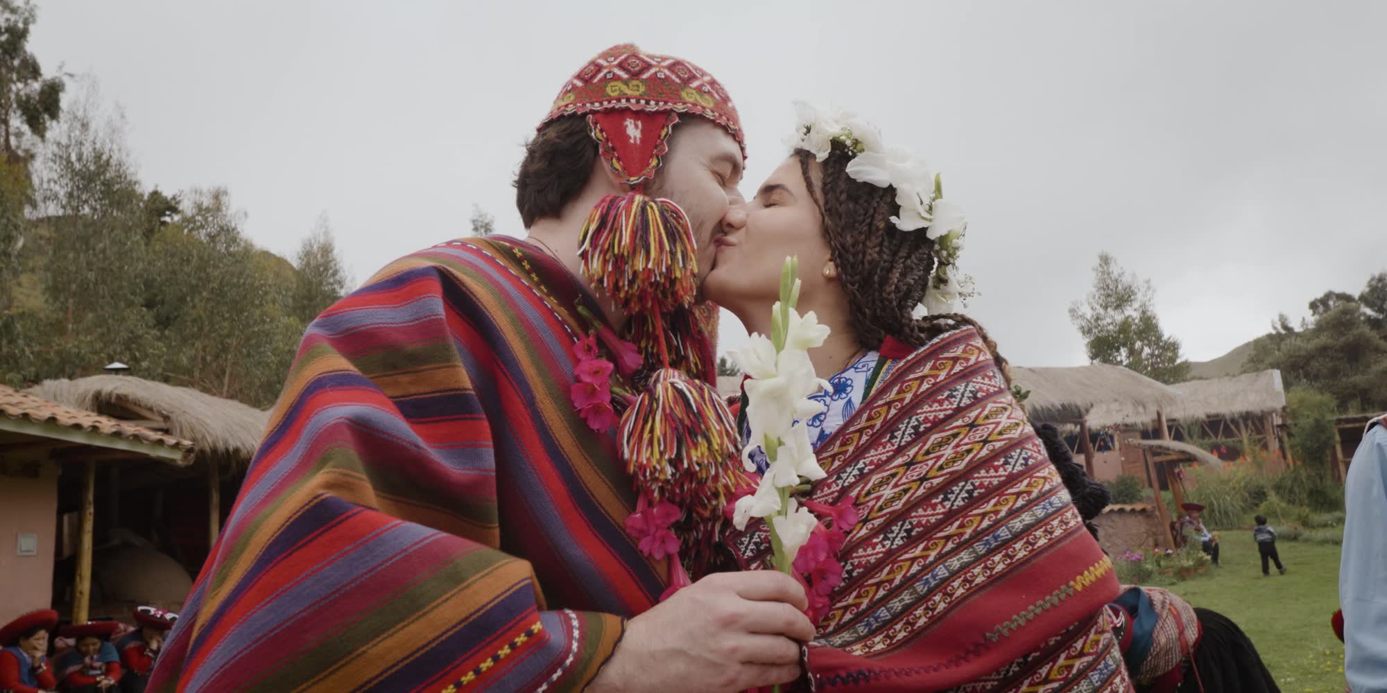 Andean wedding kiss in traditional weavings